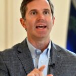 Andy Beshear speaking at a Kentucky public event.