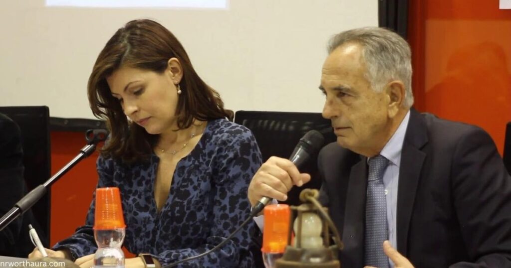 Mark Kleinman and Barbara Serra, UK journalism couple in a newsroom.