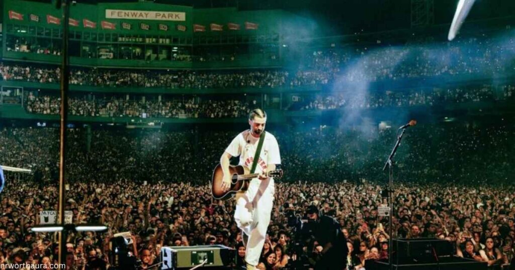 Noah Kahan performing live on stage in 2026