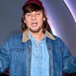 Theo Von performing live on stage in 2026.